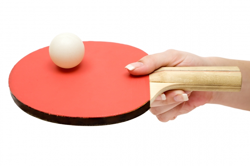 242233-holding-a-ping-pong-paddle